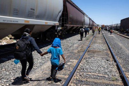 Photo for Hundreds of migrants arrive by train to Ciudad Juarez, Mexico, ready to cross the border into the United States in search of a better life. (05/13/23) - Royalty Free Image