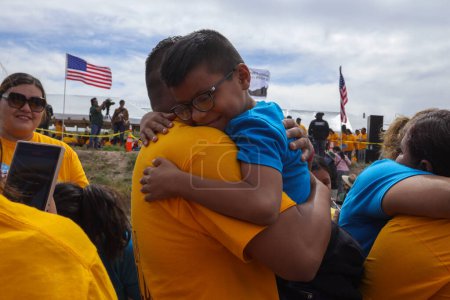 Photo for The tenth edition of the "Hugs Not Walls" event, organized by Border Network for Human Rights, takes place. The event involves families separated by US immigration policies gathering at the border to embrace each other for 3 minutes. (05/07/23) - Royalty Free Image
