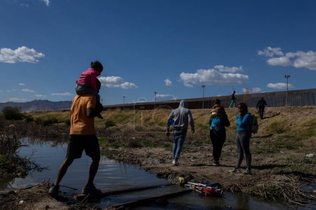 Photo for Migrants Cross the Rio Grande to Seek Asylum in the United States Before the End of Title 42 - Royalty Free Image