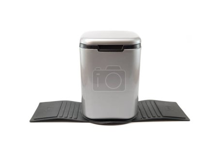 mini car dustbin and there is a mat so that the trash can doesn't fall easily in the car isolated on a white background
