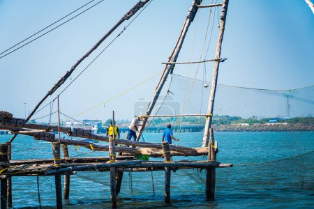 Fishermen working, Fort Kochi Kerala Coast of Arabian Sea