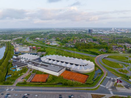 Photo for Groningen, Netherlands - 05 24 2023: Aerial of Sportcenter Kardinge with Skating Rink and Groningen City on the Background - Royalty Free Image