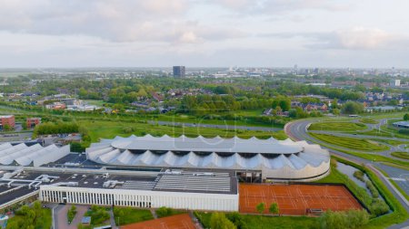 Photo for Sportcenter Kardinge with Skating Rink, Groningen City on Background - Royalty Free Image
