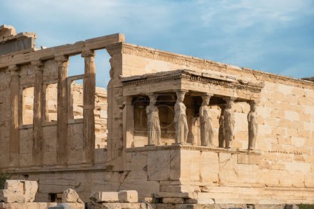 Photo for Porch of Caryatids statues at Erechtheion temple, Acropolis of Athens, Greece. Erechtheum is an ancient Greek Ionic temple of Athena Polias in Greece. Popular travel destination. - Royalty Free Image