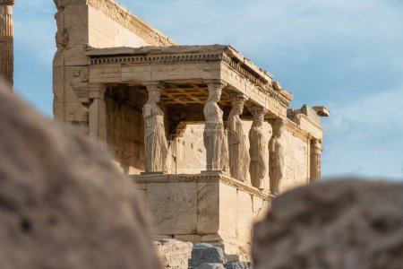 Photo for Caryatids statues at Erechtheion temple in Acropolis of Athens, Greece. Erechtheum is an ancient Greek Ionic temple of Athena Polias in Greece. Popular travel destination. - Royalty Free Image