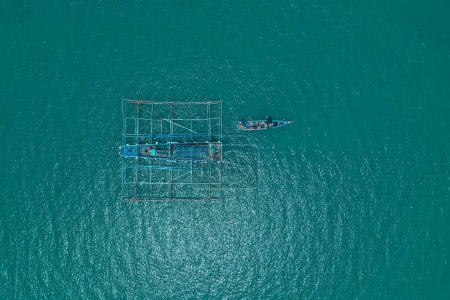 Photo for Aerial view of fishermen looking for fish in the middle of the sea - Royalty Free Image