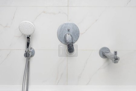 Photo for Dirty shower faucet covered in limescale and soap stains - Royalty Free Image
