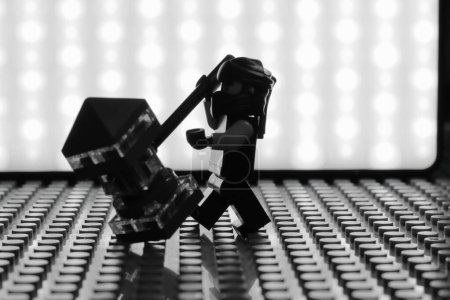Photo for Lego minifigure silhouette in action, black and white image. - Royalty Free Image