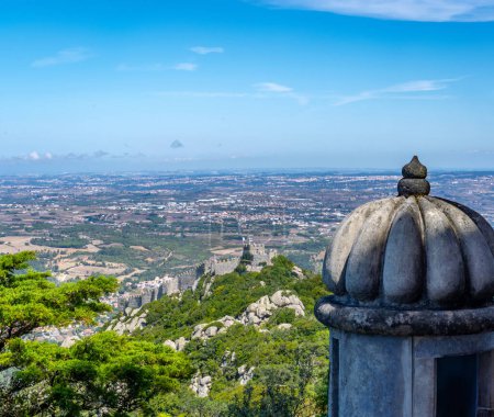 Aerial panoramic view of the Moorish castle (Castelo dos Mouros) in Sintra and the vast lands and meadows of Sintra from the stone medieval guard cabin of the Pena Palace. Portugal.