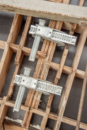 Photo for Two clamps connect the formwork panels on the construction of the bridg - Royalty Free Image