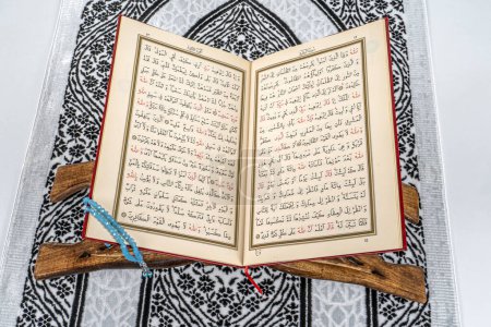 Photo for Turkey,Istanbul;2024 January 18 ; Islamic concept - The Holy Al Quran with written Arabic calligraphy of Quran and rosary beads or tasbih - Royalty Free Image