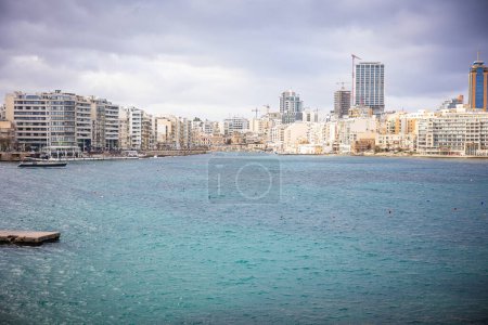 Photo for General view of the city under construction through the water barrier. Sea, coastal city. Malta. High quality photo - Royalty Free Image