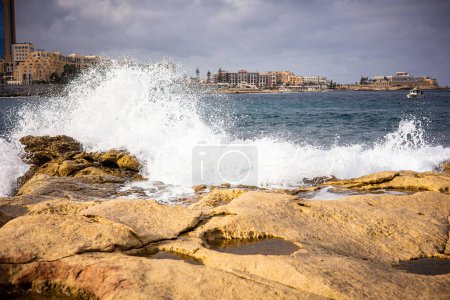 Photo for High waves of the ocean on a rocky shore. Coast of the island of Malta in winter. Splashes from ocean wave. High quality photo - Royalty Free Image