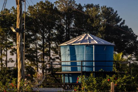 view of a water supply tank on top of the roof of a house in Brazil