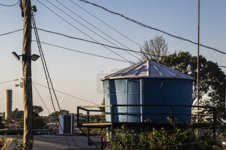 view of a water supply tank on top of the roof of a house in Brazil