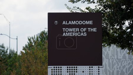 Photo for Direction sign to Alamodome and Tower of the Americas in San Antonio - SAN ANTONIO, TEXAS - NOVEMBER 01, 2022 - Royalty Free Image