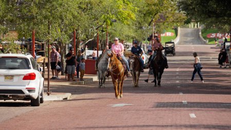 Photo for Horseback Riding through the Fort Worth Stockyards in the historic district - FORT WORTH, TEXAS - NOVEMBER 09, 2022 - Royalty Free Image