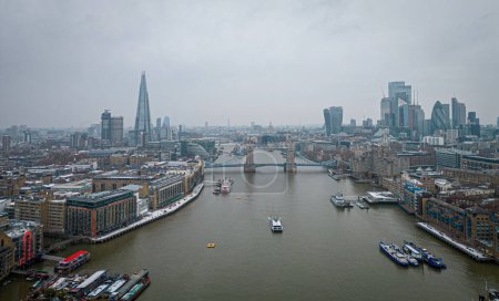 Photo for London and Tower Bridge over River Thames on a foggy day - LONDON, UNITED KINGDOM - DECEMBER 20, 2022 - Royalty Free Image