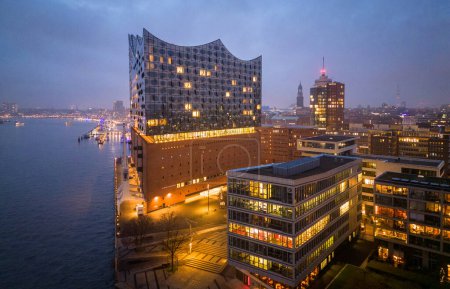 Photo for Hamburg harbor with Elbphilharmonie Concert Hall in the evening - amazing drone shot - CITY OF HAMBURG, GERMANY - DECEMBER 23, 2022 - Royalty Free Image