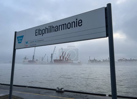 Photo for Elbohilharmonie Water Bus Stop at Port of Hamburg on a foggy day- CITY OF HAMBURG, GERMANY - DECEMBER 17, 2022 - Royalty Free Image