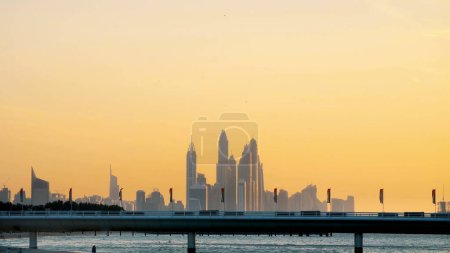Photo for DUBAI, UNITED ARAB EMIRATES, UAE - NOVEMBER 20, 2017: Hotel Jumeirah Al Naseem near with Burj al Arab. at sunset, in the distance you can see skyscrapers. High quality photo - Royalty Free Image