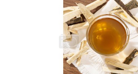 Photo for Quassia Amara - Beverage Stems Of Quassia Medicinal plant; On Wood Background With White Space For Text - Royalty Free Image