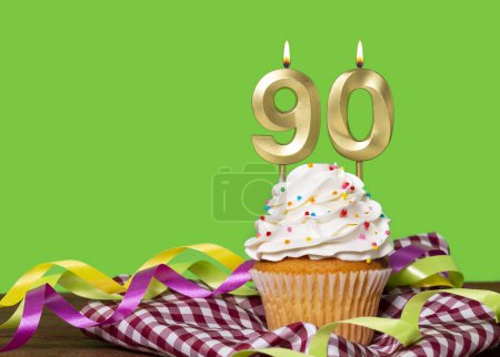 Birthday Cake With Candle Number 90 - On Green Background.