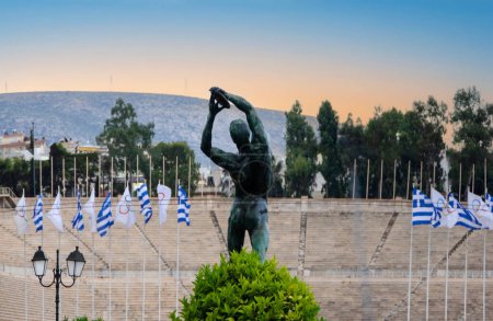 Téléchargez les photos : View from classical Athens with Panathenaic stadium (1st olympic games at 1896) and statue of discobolus stading opposite it. Greece - en image libre de droit