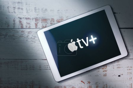 Photo for MLAGA - SPAIN - DECEMBER 21, 2022: Top view of digital tablet with Apple TV Plus logo on screen. Video streaming subscription service. - Royalty Free Image