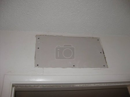 Photo for Patched Drywall Rectangle Above a Doorway Before Mudding . High quality photo - Royalty Free Image