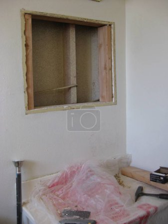 Photo for Hole in Drywall Above Sink in Bathroom, Home Remodel . High quality photo - Royalty Free Image