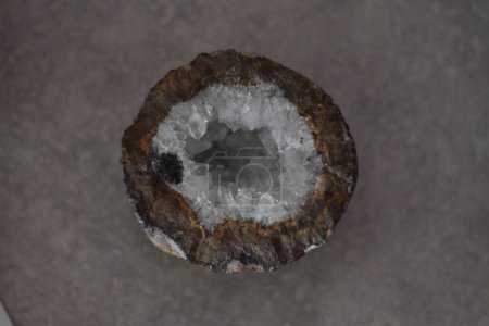 Photo for Close Up of Clear Quartz Geode Rock with Inclusion cut open on my countertop. High quality photo - Royalty Free Image