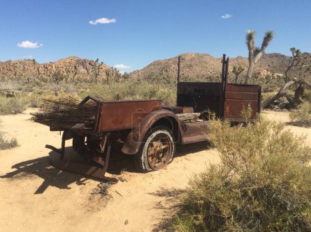 Rusty Old Car Abandoned in Near Wall Street Mill in Joshua Tree National Park . High quality photo