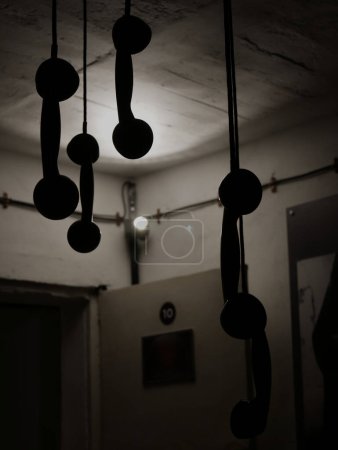 Photo for Inside Bunk'Art 2 Museum in Tirana, hanging telephone handset - Royalty Free Image