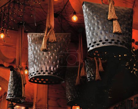 Foto de Large bells hanging in front of a wooden house - Imagen libre de derechos