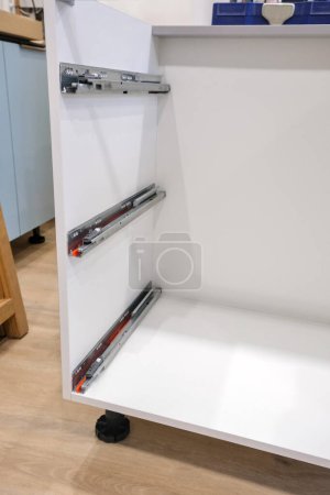 Drawer guide rail, mounted in a new kitchen cabinet.