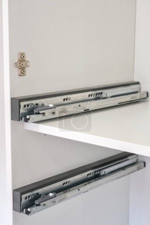 Drawer guide rail, mounted in a new kitchen cabinet.