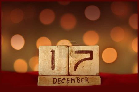 Photo for December 17 vintage wooden block calendar bokeh lights background - Royalty Free Image