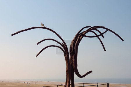Seagull on the 'Dansende Golven' (Dancing Waves) sculpture at Ostend beach, Belgium, Europe