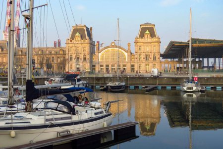 Photo for Port with yachts and train station glowing in the evening light, Ostend, Flanders, Belgium, Europe - Royalty Free Image