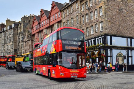 Photo for Red hop on hop off city sightseeing tour bus in historic old center - Royalty Free Image