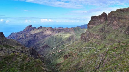 Winding road leading to Masca valley, scenic route in amazing mountain landscape. Popular Tenerife destination, Canary Islands, Spain, travel Europe.