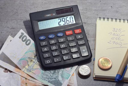 Photo for Calculator and money, budget, bookkeeping - Royalty Free Image