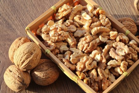 Shelled walnut kernels in a small basket