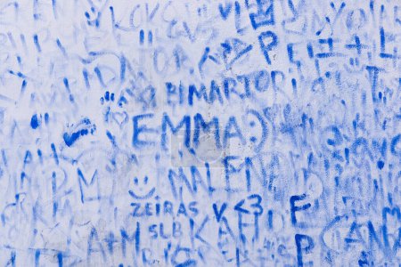 Photo for Europe, Portugal, Obidos. April 15, 2022. Blue graffiti names on a wall in Obidos. - Royalty Free Image