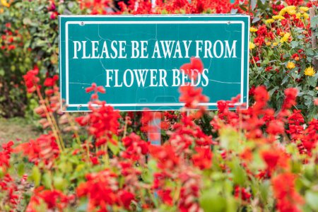 Photo for Srinagar, Jammu and Kashmir, India. October 30, 2022. Sign telling people to stay away from the flower beds. - Royalty Free Image