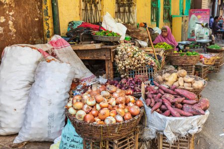 Photo for Cairo, Egypt, Africa. October 16, 2019. Onions and sweet potatoes at an outdoor market. - Royalty Free Image