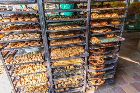 Photo for Cairo, Egypt, Africa. October 16, 2019. Racks of pastries at a Cairo bakery. - Royalty Free Image