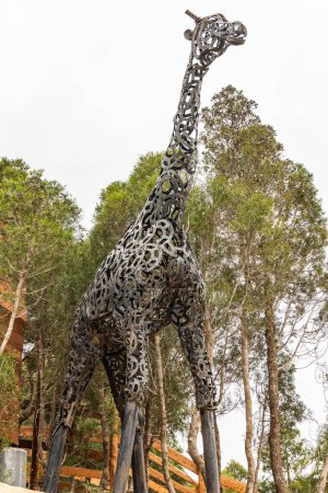 Photo for Bou Argoub, Nabeul, Tunisia. March 6, 2023. Sculpture of a giraffe made from recycled steel parts. - Royalty Free Image