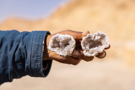 Photo for Shabikah, Tozeur, Tunisia. Man holding a crystal geode. - Royalty Free Image